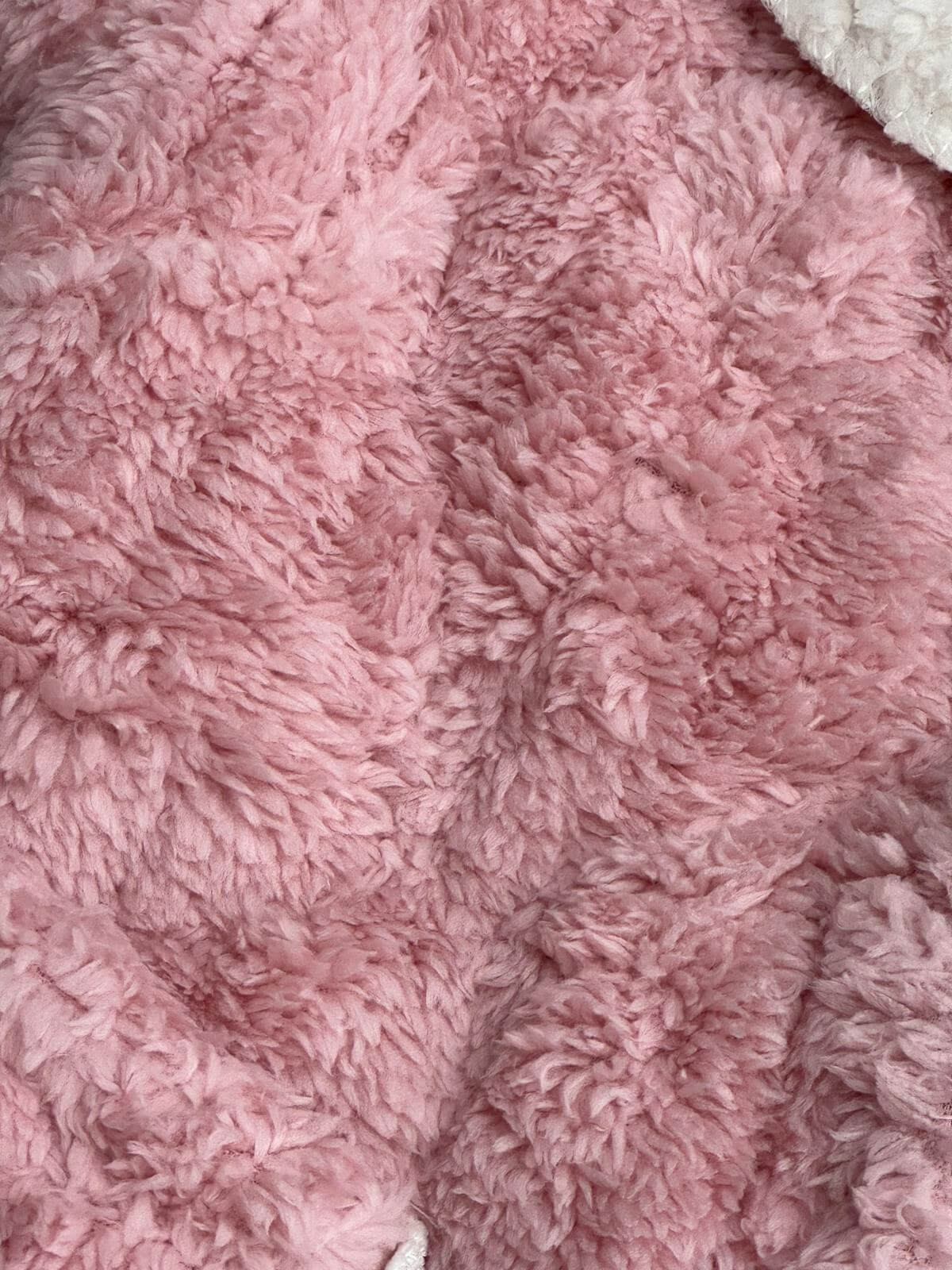 Soft baby pink fabric with fluffy texture, ideal for Quosy Suit. Features warmth retention and breathable comfort.